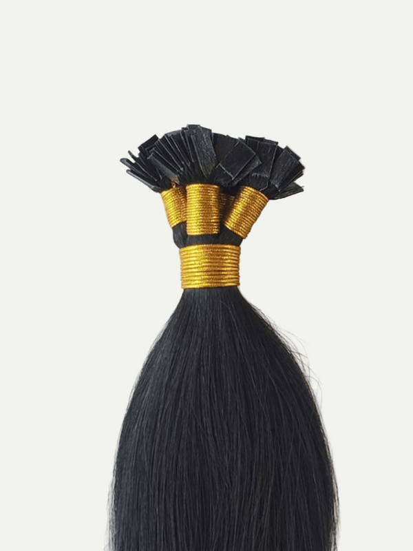 Black hair extensions with gold bands on a white background