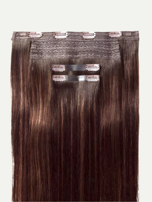 Set of hair extensions with clips on a white background