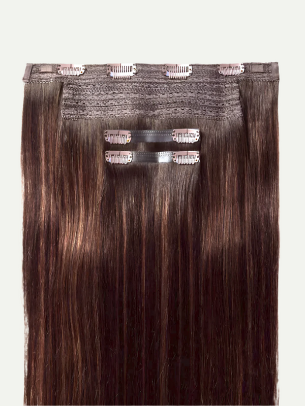 Set of hair extensions with clips on a white background