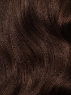Close-up of dark brown hair with a wavy texture