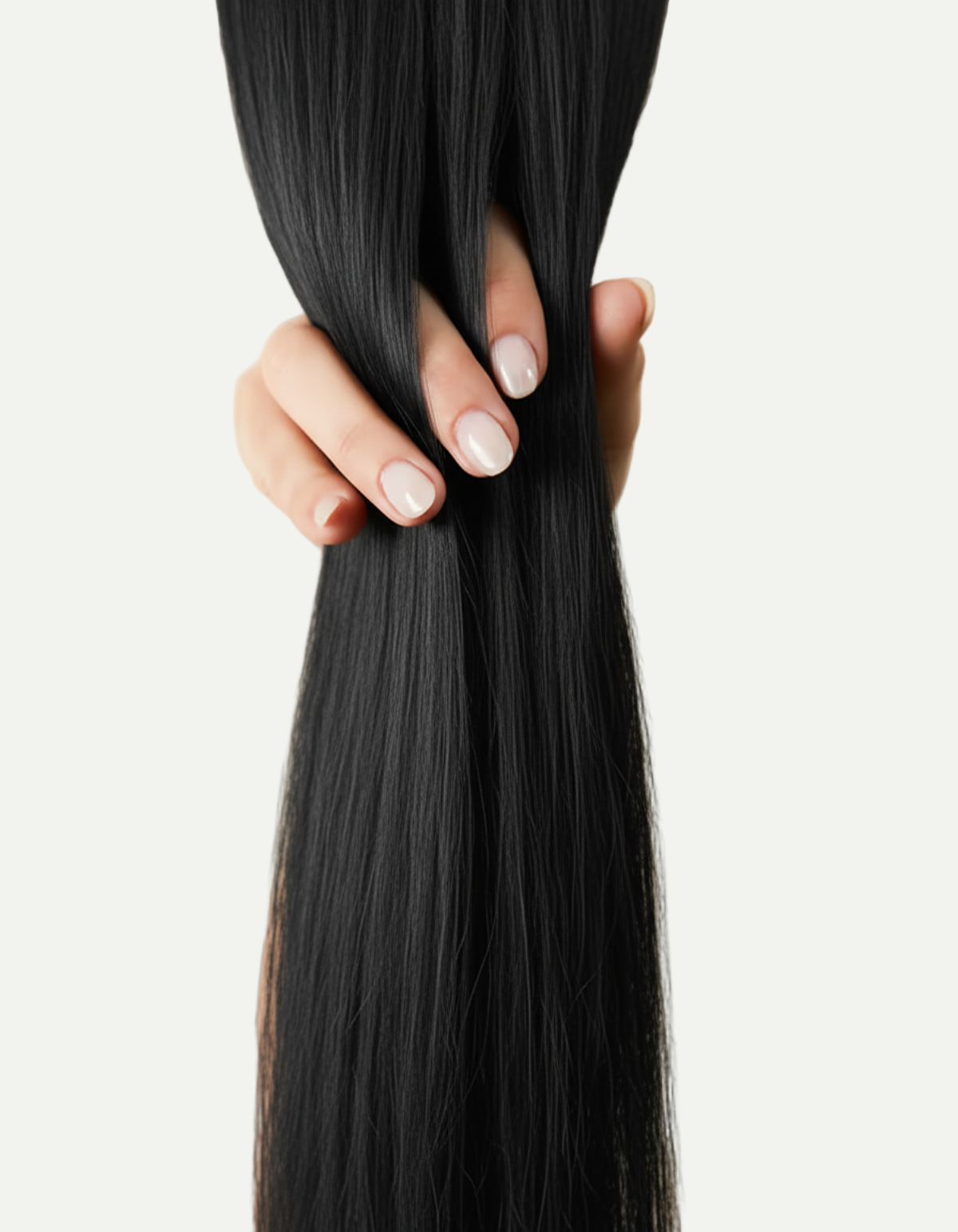 Hand holding long black hair against a beige background