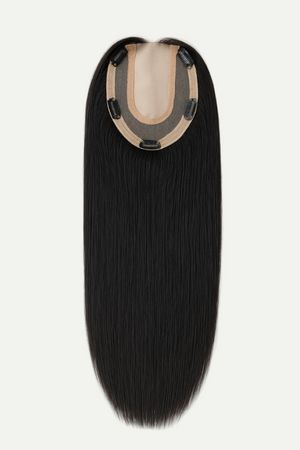 Black hair extension with a clip on a white background